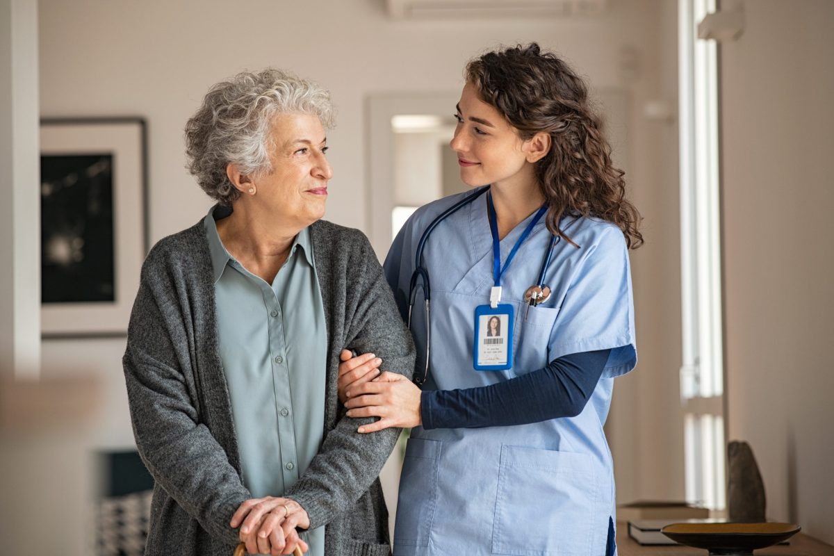nurse together with an elderly patient